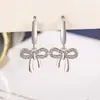 Brincos de Argola com Laço Micro-Incrustado de Diamantes para Mulheres Simples de Alto Padrão Versáteis Brincos Stud Novos Brincos Pendentes Bestseller Acessórios de Brinco para o Verão