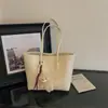 Nueva bolsa de hombro retro minimalista 2026 para mujer, gran capacidad, casual, para ir al trabajo, bolso de mano con textura tejida
