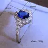 Joyería de explosiones de comercio exterior de alta gama Europa y Estados Unidos popular anillo de compromiso para dama circón azul de alta gama anillo de oro real al por mayor