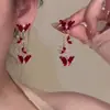Outono e inverno de 2025 brincos da sorte com laço de flocado vermelho brincos festivos de Ano Novo design de nicho joias de ouvido