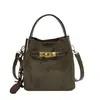 Bolso pequeño de mano con acabado mate texturizado para mujer, nuevo bolso tipo cubo retro otoño/invierno 2026, bolso de hombro/cruzado elegante y versátil