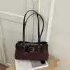 Bolso de axila de diseño nicho coreano, simple y versátil para ir al trabajo, nuevo bolso cuadrado pequeño estilo motociclista coreano 2026