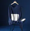 Otoño e invierno nuevo conjunto de ropa interior térmica ajustada con parche de terciopelo traje sin costuras forrado de polar ropa de otoño para hombre pantalones de otoño