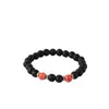 Accesorios de explosiones transfronterizas piedra volcánica negra mate de 8 mm piedra de ámbar fósil de viento pulseras de yoga para hombres y mujeres al por mayor
