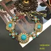 Traje de collar, pendientes y pulsera con incrustaciones de gema turquesa retro europea y americana, oro real ruso, temperamento, versátil, joyería medieval