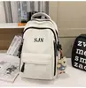 Mochila de viaje versátil estilo coreano para parejas con bordado de letras, mochila escolar elegante y duradera para chicos de secundaria y preparatoria