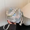 Bolso Pequeño de Perlas Estilo Chino Nuevo Transfronterizo para Mujer 2025 Nuevo Bolso Cruzado de Verano Bolso Cubo de Mariposa Estilo Occidental de Alta Gama