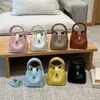 Bolso tipo cubo de diseño nicho nuevo de primavera, moderno, casual, único, bandolera cruzada de hombro de moda para mujer 2026