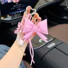 Llavero colgante con forma de corazón de cuero, lazo personalizado, nuevo artículo de moda, accesorio de bolso creativo y versátil.
