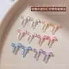 Accesorios de moño para decoración de uñas transparentes tallados suavemente, populares en Xiaohongshu, decoraciones de moño de cinta impresas esmeriladas para uñas