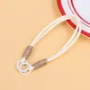 Colgante de juguete de peluche con cordón tejido multicolor, correa de muñeca para teléfono móvil, correa corta de mano con doble hebilla, accesorio de cordón de nailon