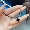 Estilo Coreano Moderno y Sencillo Flor de Cuatro Hojas Diseño de Correa Corta para el Cuello Cadena de Cristal para la Clavícula Femenina de Alta Gama Versátil Lujo Ligero