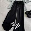 Pantalones casuales retro de tres rayas para hombre, holgados y cómodos, estilo simple, adecuados para el uso diario, versátiles, cintura elástica, adecuados para usar al aire libre