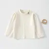 Nuevo suéter de punto suave y acogedor para bebé de otoño, cuello redondo, top versátil, camiseta básica elegante de manga larga para bebé estilo coreano
