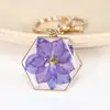 Ed nuevo llavero de flor seca espécimen de rosa metal de acero inoxidable hebilla de langosta accesorios de ropa fabricantes al por mayor