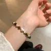 Plata Pura Acabado Mate Suave con Piedra Ojo de Tigre Pulsera Nueva para Mujer Versátil Bolas Redondas Pulsera de Gama Alta Forma de Corazón Estilo Coreano Nicho