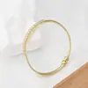 Pulsera de cobre con incrustaciones de circonita de fábrica directa transfronteriza para mujer, pulsera geométrica abierta avanzada estilo Ins, joyería, joyería europea y americana