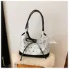 Bolso de hombro cruzado con lazo para mujer, nuevo de primavera-verano, para el antebrazo, único, casual, versátil, de compras, para chica linda