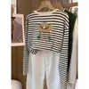 Camiseta de manga larga a rayas de algodón puro para mujer, nuevo modelo 2026, estilo coreano, holgada, moderna, top versátil, camiseta básica, artículo popular de otoño