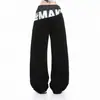 Jeans de mujer con estampado de estilo callejero americano 2026, patchwork, doble cintura, pantalones casuales de otoño con un diseño único, pantalones de pierna recta con corte curvo