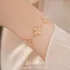 Pulsera de flor de piedra ojo de gato de circón ultrabrillante estilo ins coreano, sensación de lujo ligero y alta gama, joyería femenina exquisita y versátil