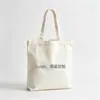 Bolsas de lona personalizadas com logo, bolsas tote de lona lisas com designs personalizados, bolsas de algodão para a temporada de formatura, treinamentos e aulas de reforço