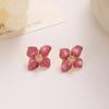 Aretes de flor retro estilo coreano con esmalte de gota, flor de cuatro pétalos, moda de alta gama para mujer, exquisitos aretes de aleación de flor de cuatro hojas, aretes netos rojos
