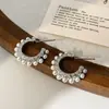 Pendientes de Botón Elegantes Minimalistas Estilo Francés Lujo Ligero Gama Alta Perla Brillante Moda Versátil para el Trabajo Diseño de Nicho Pendientes