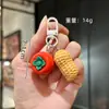 Llavero creativo de caqui personalidad simulación de caqui bolsa de cacahuete colgante pequeño venta al por mayor decoración divertida para coche