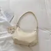 Outono 2026 Nova Bolsa Estilo Coreano Bolinho Bolsa de Ombro Único Transversal Moda Retro Simples Elegante Relaxada Bolsa de Axila