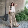 Conjunto de Duas Peças Moda Casual Verão 2026 Jovem Elegante Renda Vazada Camisa e Calça Wide Leg Estampada