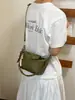 A bolsa de bolinho trançada popular deste ano para mulheres 2026 nova bolsa de ombro simples estilosa bolsa transversal de nicho coreana