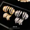 Pendientes irregulares de plata con incrustaciones de diamantes de estilo europeo y americano, modernos y versátiles para el uso diario, sensación de lujo ligero y alta gama, venta al por mayor