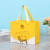 Bolsa de papel tridimensional de mano recubierta con estampado en caliente, impresión de logotipo personalizado, embalaje, bolsa de regalo, bolso de mano de regalo comercial, venta al por mayor