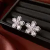 Pendientes de borla con flor de trébol de circonita vintage con un toque de alta gama, pendientes versátiles y de moda al por mayor