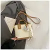 Bolsa pequena feminina 2026 nova moda tendência bolsa de mão popular bolsa de balde versão coreana versátil bolsa de ombro transversal para mulheres