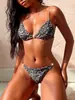 Traje de baño de dos piezas con estampado de leopardo para mujer, nuevo, europeo y americano, bikini sexy de tirantes de alta gama, traje de baño de playa, venta al por mayor
