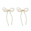 Joyas transfronterizas europeas y americanas Pendientes de lazo pendientes de botón de lazo estilo ins mariposa temperamento pendientes anudados de perla sintética para mujer