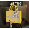 Bolsa feminina de nicho de alta qualidade, nova bolsa de mão com laço da moda de verão 2026, bolsa tote color block de bolinhas