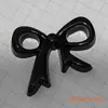 Atacado Venda Quente Dopamina Buraco Preto Sapatos Laço Acessórios de Cabelo Sapatos e Chapéus Roupas DIY Capa de Celular Acessórios Decorativos