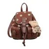 Mochila estilosa e moderna com um design único, alto apelo estético, bolsa feminina de nicho e fashion, mochila versátil e casual, mochila escolar de bolinhas