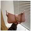 Bolsa de Mão/Transversal/Ombro Texturizada e Moderna 2025 Simples Nova Moda Cor Sólida Design Casual Francês para Mulheres