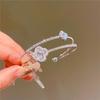 Pulsera de trébol de cuatro hojas de circonita microincrustada plateada con apertura de diamante completo, pulsera de alta gama, pulsera elegante de moda, pulsera sencilla de lujo ligero para mujer