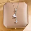 Nueva cadena de clavícula de lujo estilo coreano, collar versátil de acero de titanio de moda para mujer, colgante simple clásico de circón, accesorio versátil