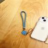 Flor trançada moderna com torção, cordão para celular, pulseira curta para pulso, alça de mão portátil, aplicável a capa de celular, capa de fone de ouvido