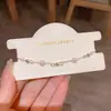 Pulsera Sencilla Versátil de Flor Hueca con Perlas para Mujer, Lujo Ligero, Nicho, Personalidad, Lujo Ligero, Dulce, Joyería al por Mayor