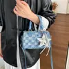 Bolsa de mano con textura de alta calidad al por mayor, bolsa tipo almohada, bolso para mujer, nuevo de otoño 2026, bolso de hombro de mezclilla a cuadros, bolso cruzado para el trabajo