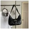 Bolso de luna nuevo, único y elegante, versátil para ir al trabajo, bolso de hombro retro europeo y americano de moda, bolso de hombro con tachuelas para mujer