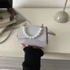 Bolsa de Hombro Casual de Aspecto Elegante Estilo Nuevo Primavera 2026 Bolso de Mano Bolso de Noche Perla Simple Moda Bolso Cruzado para Mujer