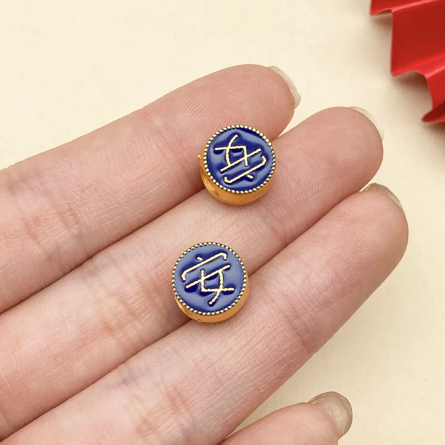 22679-ZY2-蓝色滴油亮金双面横孔安字间隔珠7x6mm